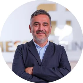 Dr Edward Gonzalez-Gomez, arms folded, at The Messina Clinic